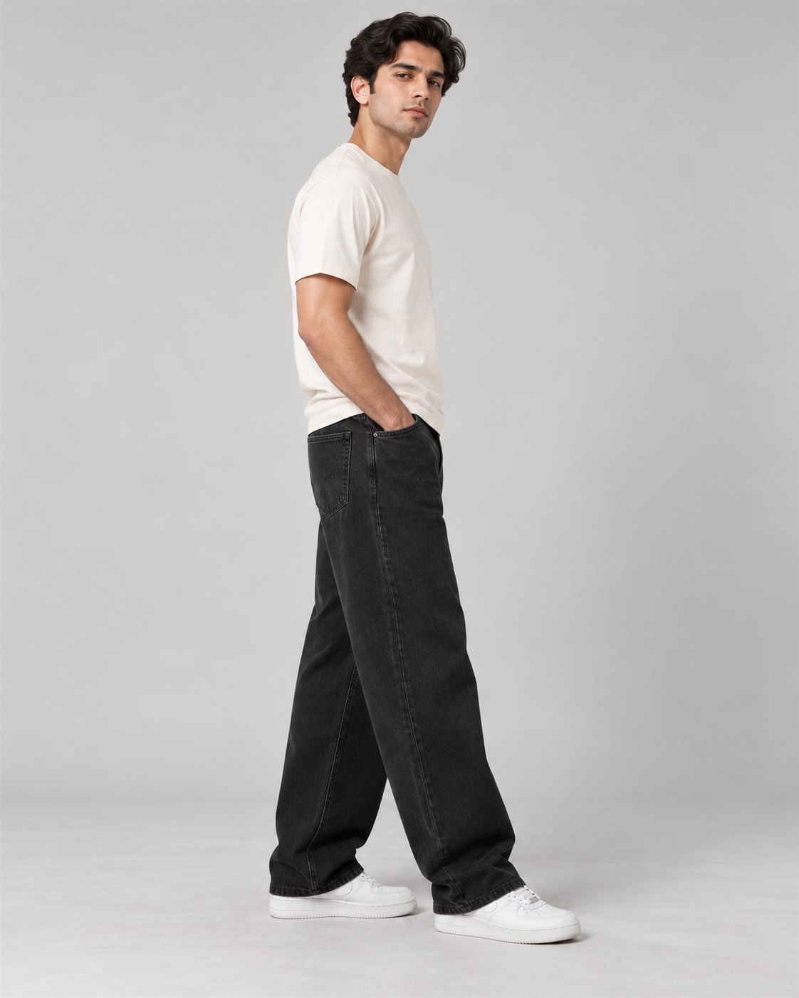 Men wearing black relaxed wide-leg jeans, side view