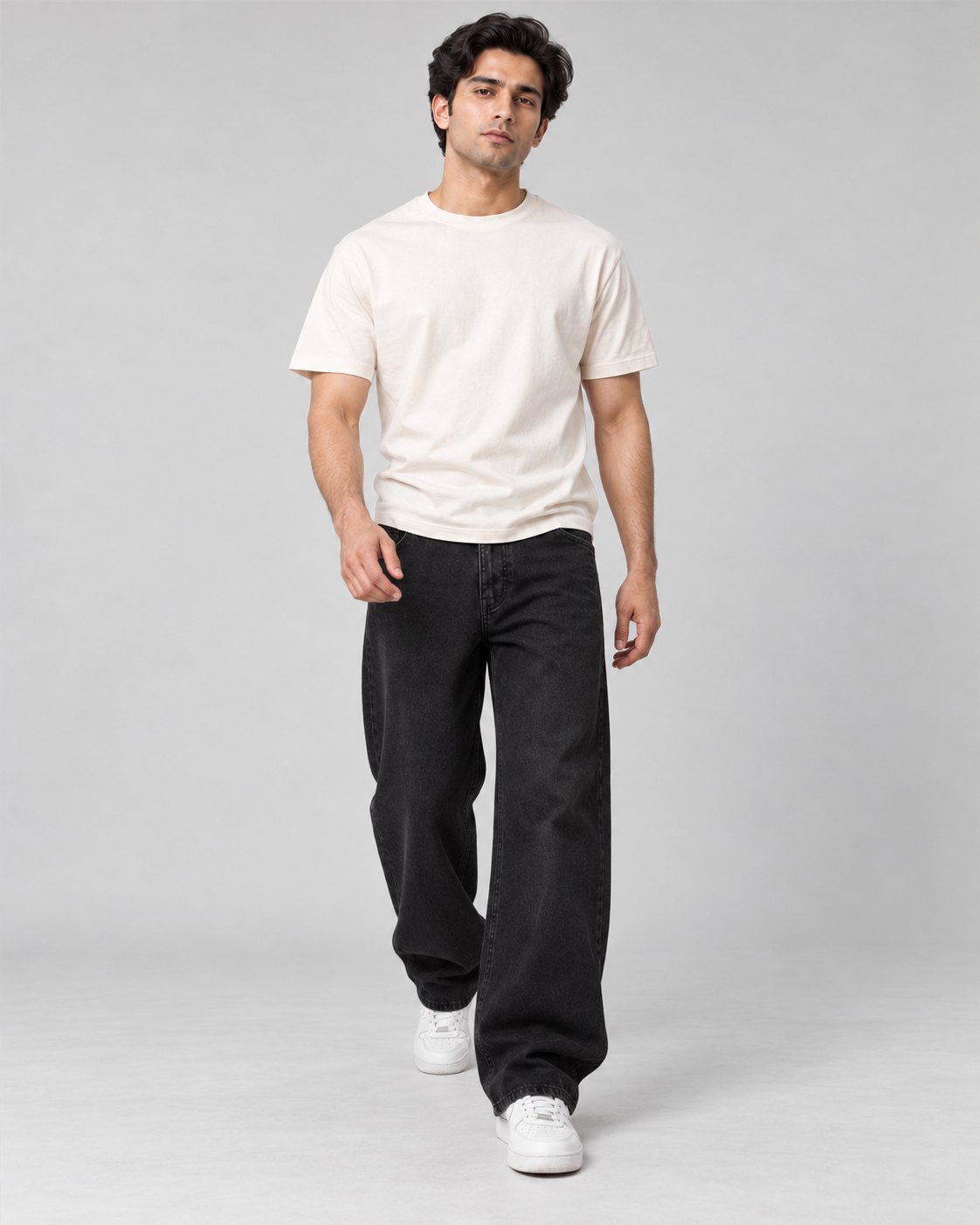 Men wearing black relaxed wide-leg jeans, walking pose